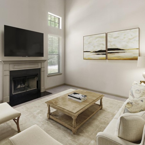 Generous living spaces with beautiful natural lighting a living room with a fireplace