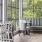 a room with a couch and chairs